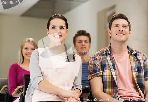 Image of group of smiling students in lecture hall