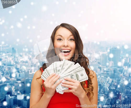 Image of woman in red dress with us dollar money