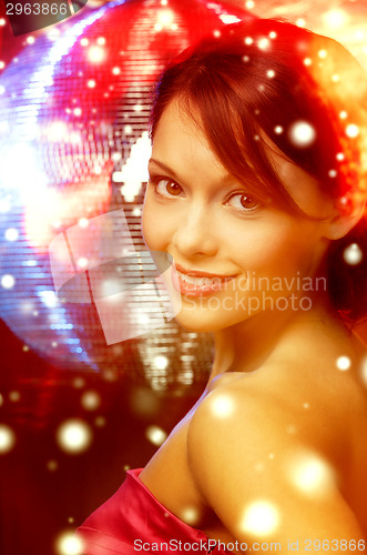Image of woman in evening dress wearing diamond earrings