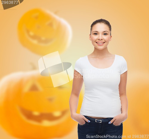 Image of smiling young woman in blank white t-shirt