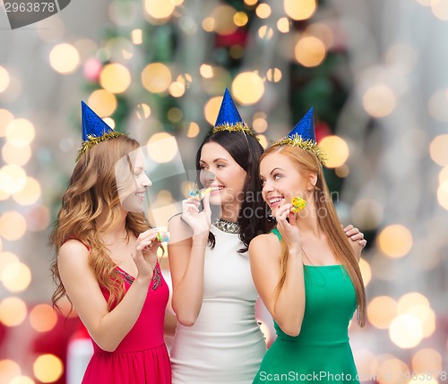 Image of smiling women holding glasses of sparkling wine