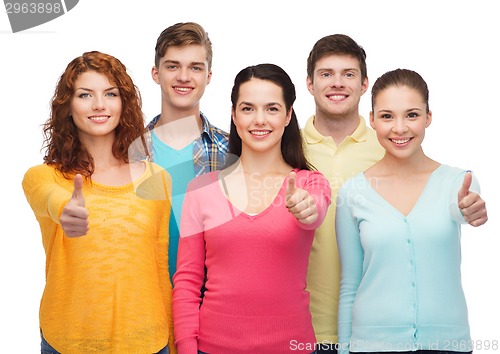 Image of group of smiling teenagers showing thumbs up