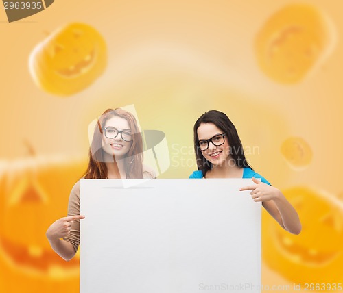 Image of smiling teenage girls with white board