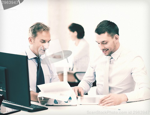 Image of businessmen with notebook and tablet pc