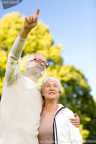 Image of senior couple hugging in park