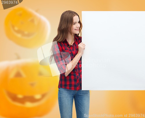 Image of smiling teenage girl with white board