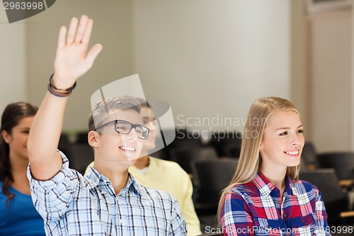 Image of group of smiling students in lecture hall