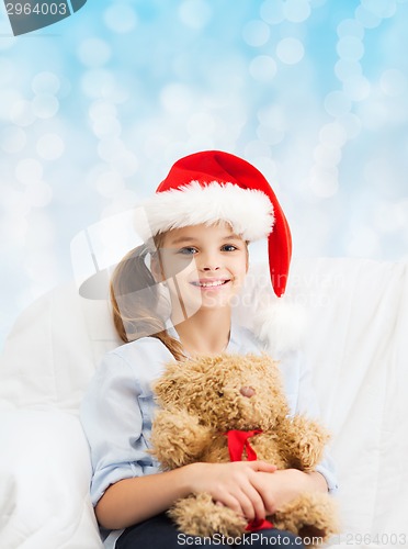 Image of smiling little girl with teddy bear