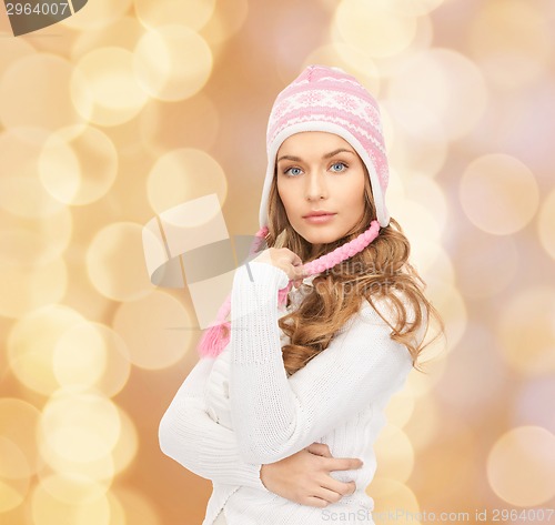 Image of smiling young woman in winter clothes