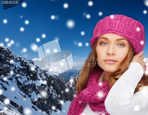 Image of smiling young woman in winter clothes