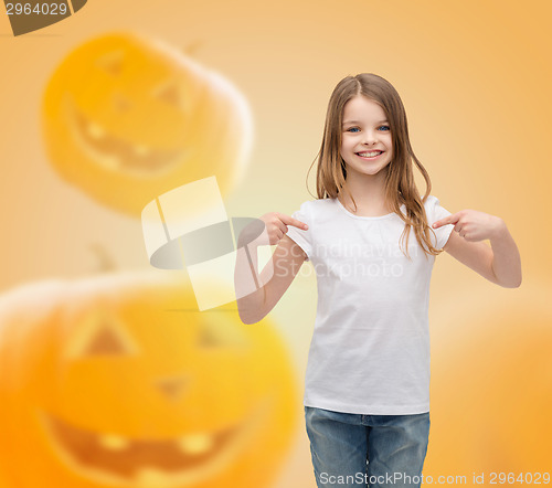 Image of smiling little girl in white blank t-shirt