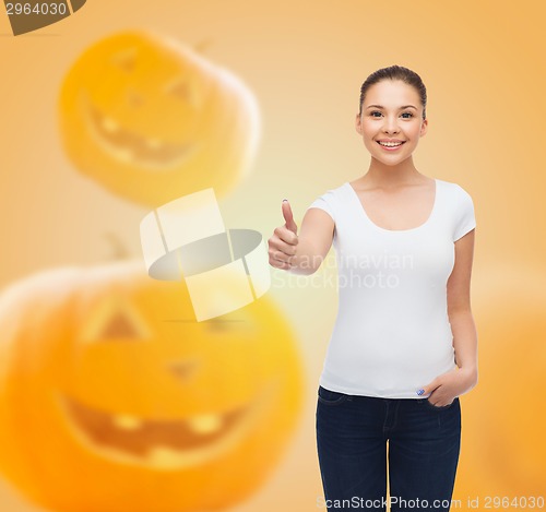 Image of smiling young woman in blank white t-shirt