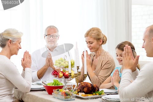 Image of smiling family having holiday dinner at home