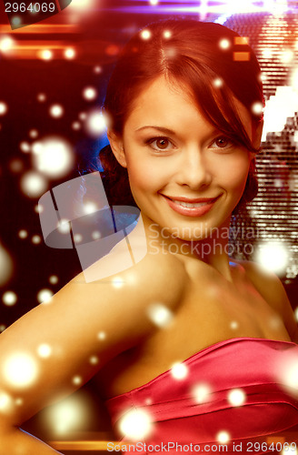 Image of woman in evening dress wearing diamond earrings