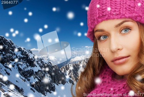 Image of close up of smiling young woman in winter clothes