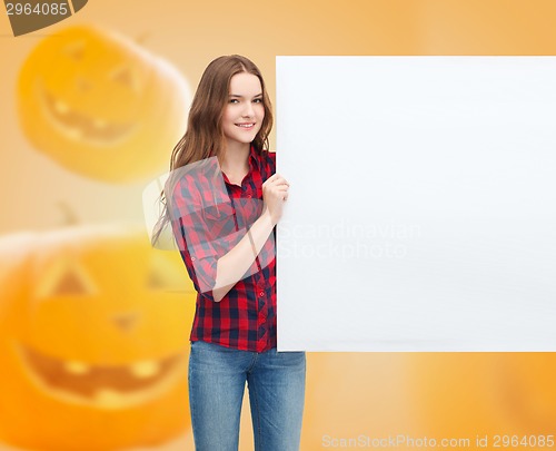 Image of smiling teenage girl with white board