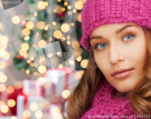 Image of close up of smiling young woman in winter clothes