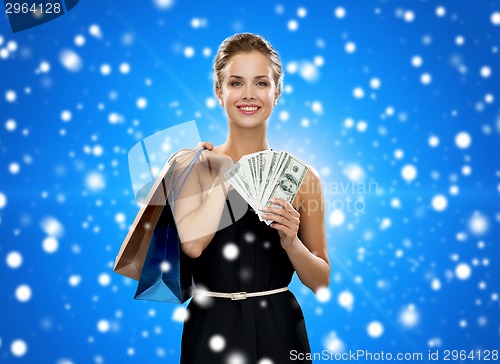 Image of smiling woman with shopping bags