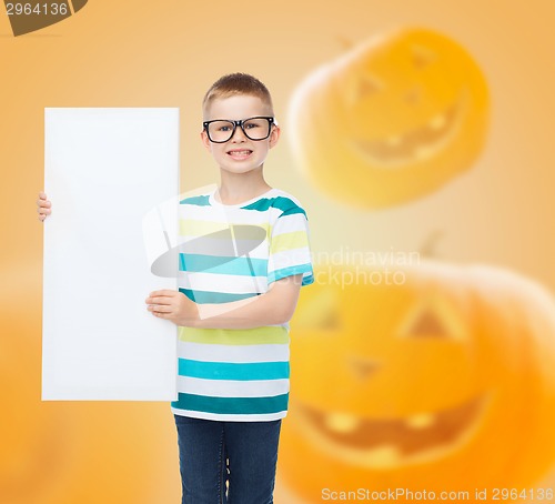 Image of smiling little boy with white board