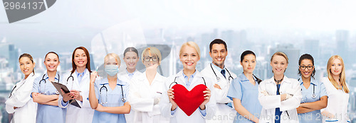 Image of smiling doctors and nurses with red heart