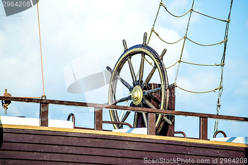 Image of wheel of an old sailing ship