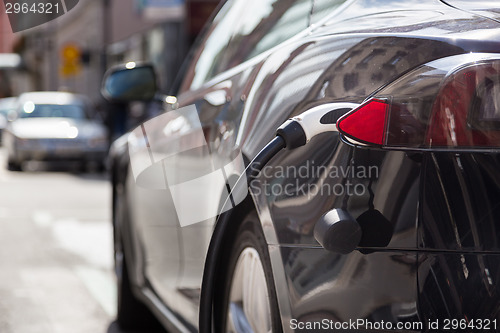 Image of Electric Car in Charging Station.