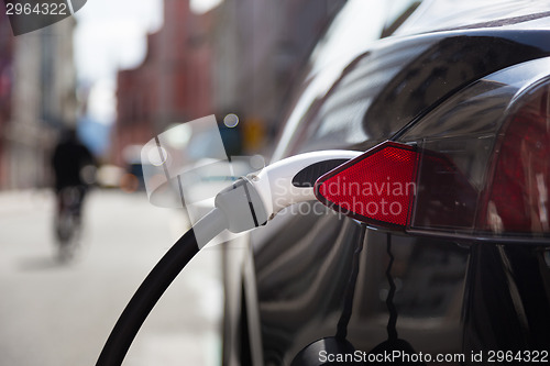 Image of Electric Car in Charging Station.