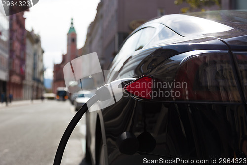 Image of Electric Car in Charging Station.