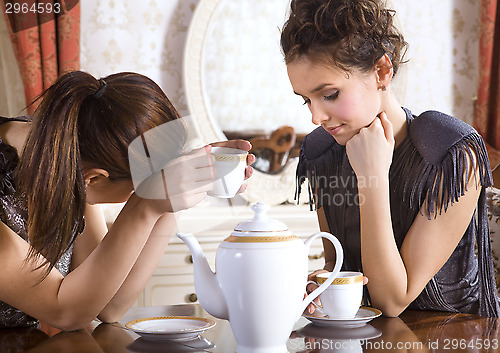 Image of Two friends drink tea