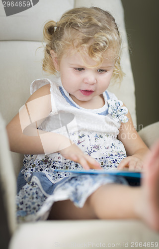 Image of Blonde Haired Blue Eyed Little Girl Reading Her Book