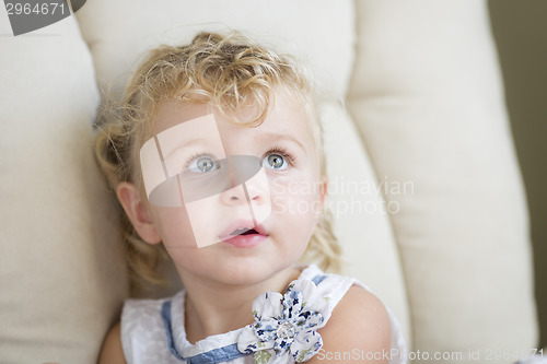 Image of Adorable Blonde Haired and Blue Eyed Little Girl in Chair