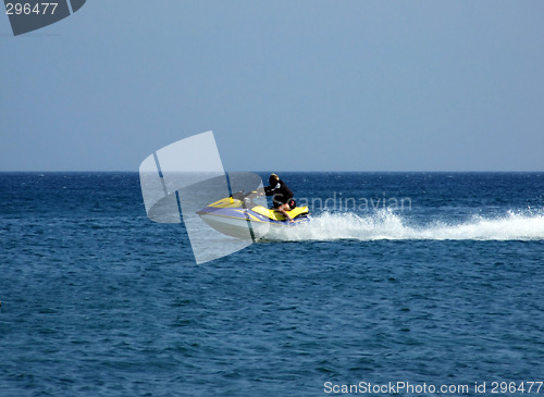 Image of The men goes for a drive on a wave runner on sea waves 1