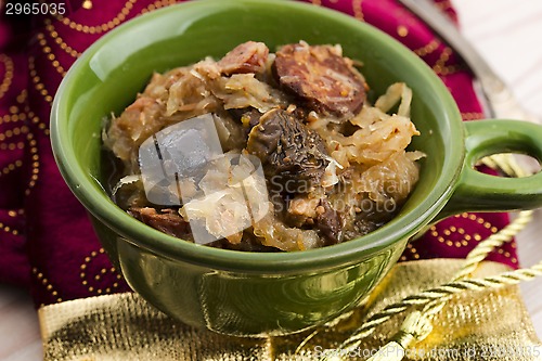 Image of traditional polish sauerkraut (bigos) with mushrooms and plums
