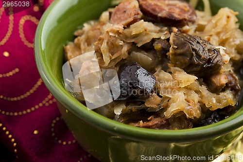 Image of traditional polish sauerkraut (bigos) with mushrooms and plums