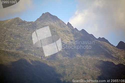 Image of Mountain peak by the clouds