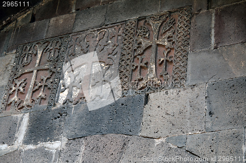 Image of Carved crosses in a row on the wall of Geghard monastery
