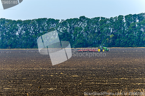 Image of Tractor plowing the land