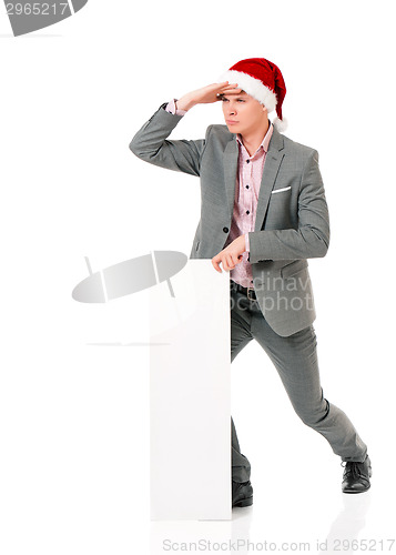 Image of Young man in Santa hat