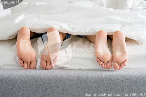 Image of Sweet Couples Feet Soles on Bed