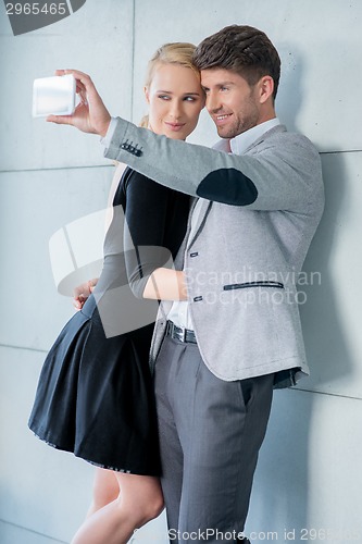 Image of Stylish young couple taking a self-portrait