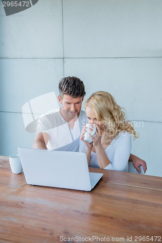 Image of Couple using a laptop together