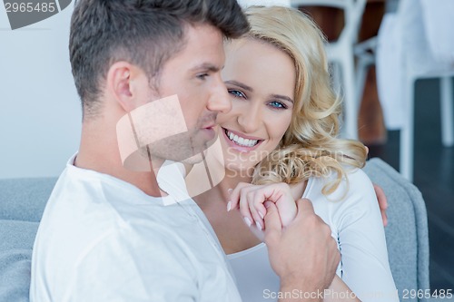 Image of Beautiful blond woman relaxing with her husband