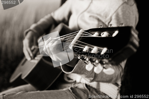 Image of Playing guitar