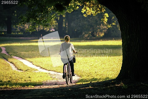 Image of Young woman on bike