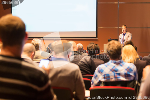 Image of Speaker at Business Conference and Presentation.