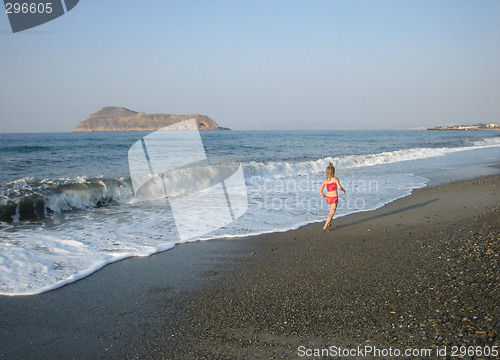 Image of Girl running on the beach