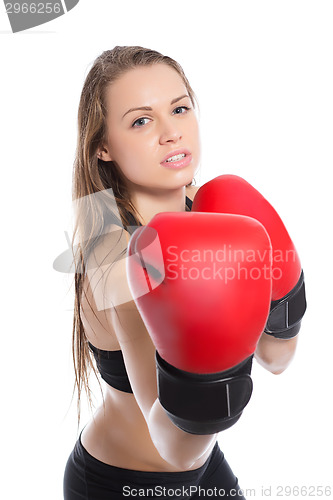 Image of Young blonde demonstrating boxing gloves.