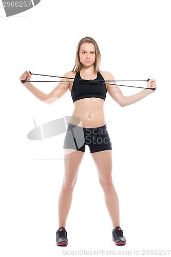 Image of Pretty young woman doing exercises