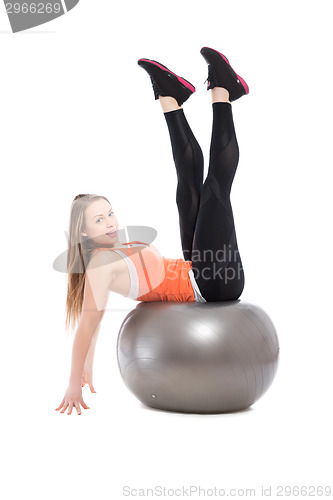 Image of Young woman doing exercises