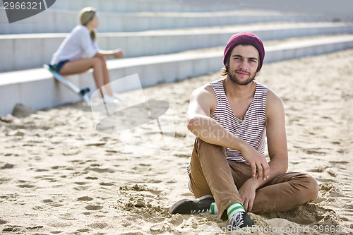 Image of Guy hanging on a beach